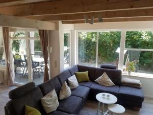 a living room with a couch and a table at Aalborg in Brodersby