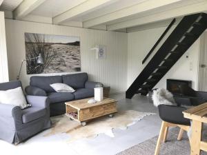 a living room with a couch and a coffee table at Luft Pur Ort in Kappeln