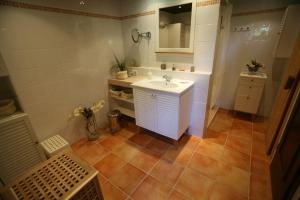 a bathroom with a white sink and a mirror at Schlei-Juwel in Brodersby +21 photos