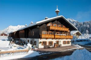 a chalet in the mountains in the snow at Das Glaagut - Familie Hain in Hochfilzen