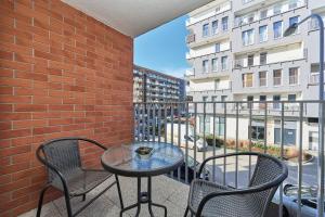 Balkón alebo terasa v ubytovaní Apartments Dmowskiego Kępa Mieszczańska by Noclegi Renters