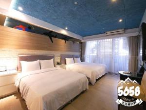 Postel nebo postele na pokoji v ubytování R8 Eco Hotel