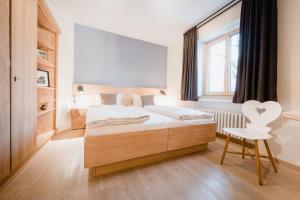 Postel nebo postele na pokoji v ubytování Bavaria Biohotel