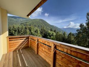 a balcony with a view of the mountains at Panorama Rosie Design Chalet in Bad Kleinkirchheim