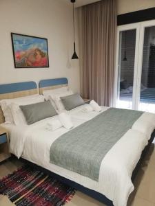 Postel nebo postele na pokoji v ubytování City Pearl Dntwn Apts