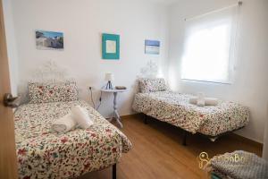 A bed or beds in a room at Apartamento en Ronda Ocho Caños con Wifi