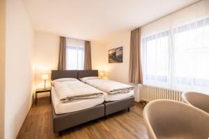Postel nebo postele na pokoji v ubytování Hotel Restaurant Alte Brauerei