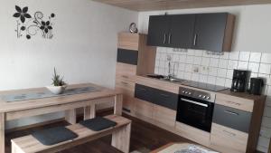 a kitchen with wooden counters and a stove top oven at Köppl Katrin in Lam