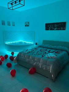 a bedroom with a bed with red balls on the floor at Rosa Dei Venti Apartment in Catania +8 photos