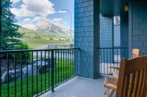 a balcony with a view of a mountain at Silver Creek Lodge in Canmore