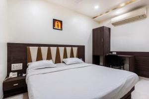 Postel nebo postele na pokoji v ubytování Hotel Ashish