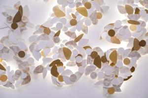 a bunch of white and brown leaves on a ceiling at InterContinental Paris Champs Elysées Etoile, an IHG Hotel in Paris