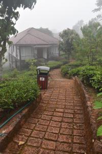 Taman di luar Jeevess Retreat Wayanad