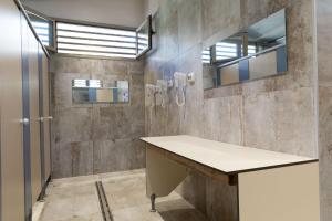 a bathroom with a sink and a mirror at Pigna Felice Punta Ala in Punta Ala