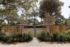 a house with a gate and a fence at Pigna Felice Punta Ala in Punta Ala