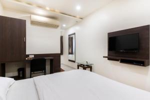 TV a/nebo společenská místnost v ubytování Hotel Ashish