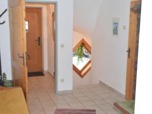 un couloir avec un escalier menant à une maison dans l'établissement Chalet in Maria Alm in ski area with sauna, à Maria Alm