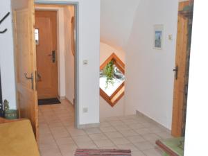 a hallway with a stairway leading into a house at Chalet in Maria Alm in ski area with sauna in Maria Alm am Steinernen Meer