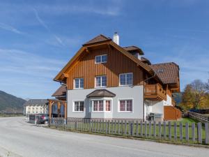 a house with a wooden roof at Apartment in St Margarethen with balcony in Sankt Margarethen im Lungau