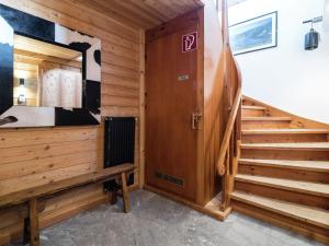 a room with a staircase with a cow painting on the wall at Idyllic Chalet in Kaprun near Ski Area in Kaprun