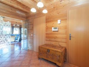 a room with a wooden wall with a wooden door at Chalet in Sankt Margarethen with sauna in Sankt Margarethen im Lungau