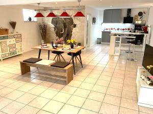 a kitchen and dining room with a table in a room at Am Wildbach bei Passau in Saming