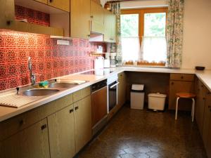 A kitchen or kitchenette at Spacious Chalet in Flachau with Sauna