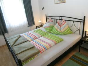 A bed or beds in a room at Apartment in Rennweg near Katschberg Ski Area