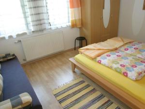 A bed or beds in a room at Apartment in Rennweg near Katschberg Ski Area Még 17 kép
