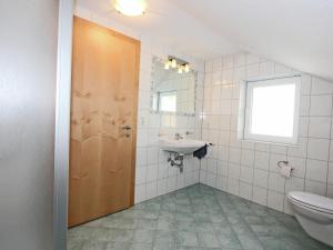 a bathroom with a toilet and a sink at Chalet in Fiss near Ski Lifts in Fiss
