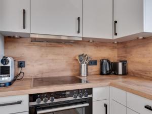 A kitchen or kitchenette at Modern Chalet in Mühlbach am Hochkönig near Ski Area