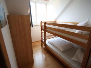 A bed or beds in a room at Apartment St Margarethen near Ski Lift