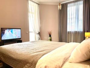 Tempat tidur dalam kamar di NAVIT two room apartments with breakfast near the railway station,the city center and the park