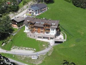 an aerial view of a large house on a green field at Modern apartment near Saalbach Hinterglemm in Viehhofen