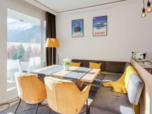 a dining room with a table and chairs at Cosy flat in Zweiselstein with Garden in Sölden