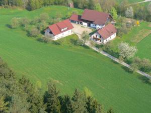 an aerial view of a house in a field at Holiday apartment near Lake Klopeiner with sauna in Neuhaus