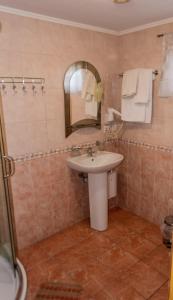 a bathroom with a sink and a mirror at Приозерний заїзд 