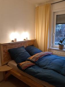 Postelja oz. postelje v sobi nastanitve Rustikale Ferienwohnung mit Kamin