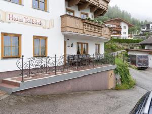 a house with a balcony on the side of it at Quaint Apartment in Hainzenberg near Horbergbahn in Hainzenberg