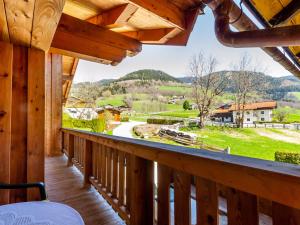 a view from the balcony of a log cabin at Simplistic Apartment in Piesendorf Walchen near Ski Slopes in Piesendorf