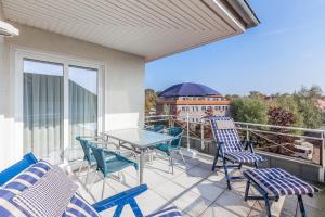 Ein Balkon oder eine Terrasse in der Unterkunft Waterkant Wohnung 19 - Klabautermann