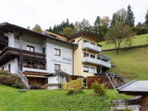 a large building on top of a hill at Apartment in Zell am See with Ski Storage Parking Balcony in Zell am See