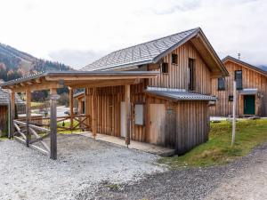 a wooden cabin with a gambrel roof at Chalet in Hohentauern in the ski area in Hohentauern