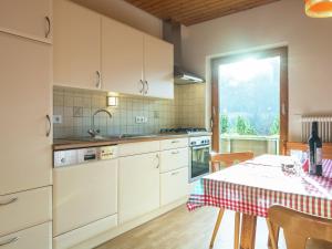 A kitchen or kitchenette at Picturesque Apartment in Thomatal Salzburg near Forest