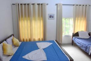 Postel nebo postele na pokoji v ubytování Hotel H2O