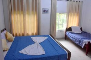 Postel nebo postele na pokoji v ubytování Hotel H2O