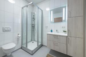Koupelna v ubytování Nortia Apartments + 15 fotografií