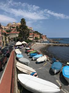 a bunch of boats parked next to the water at Appartamento sul mare alla Foce in Imperia