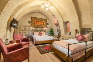 Postel nebo postele na pokoji v ubytování Maron Stone House