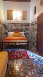 Postel nebo postele na pokoji v ubytování Riad amal